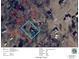 Aerial view showing property lines and nearby homes in a residential area with mature trees and well-defined streets at 201 Barnes Ln, Stony Point, NC 28678