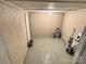 Unfinished basement features ample storage space, and a utilitarian aesthetic with paint supplies at 201 Barnes Ln, Stony Point, NC 28678