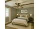 Bedroom featuring neutral walls, wood-look floors, updated ceiling fan, and ceiling with wood accents at 201 Barnes Ln, Stony Point, NC 28678