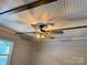 View of the coffered ceiling and large ceiling fan in the bedroom at 201 Barnes Ln, Stony Point, NC 28678