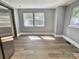Bright, neutral empty room with lots of light and hardwood flooring, ready for a new chapter at 201 Barnes Ln, Stony Point, NC 28678