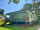 Charming home with an inviting front porch, wood railing, and green siding at 201 Barnes Ln, Stony Point, NC 28678