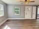 Bright living room featuring hardwood floors, neutral paint, and natural light from a window at 201 Barnes Ln, Stony Point, NC 28678