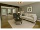Bright living room featuring hardwood floors, neutral paint, modern furniture, and natural light at 201 Barnes Ln, Stony Point, NC 28678