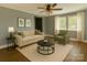 Cozy living room featuring hardwood floors, neutral paint, modern furniture, and natural light at 201 Barnes Ln, Stony Point, NC 28678