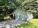 Backyard outbuilding with green siding and gravel leading up to it at 201 Barnes Ln, Stony Point, NC 28678