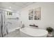 Luxurious bathroom with a standalone tub, tiled shower, and stylish decor at 2028 Old Latter Rd, Newton, NC 28658