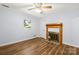 Comfortable bedroom featuring neutral walls, wood-look flooring, and a charming fireplace at 2028 Old Latter Rd, Newton, NC 28658