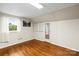 Cozy bedroom featuring hardwood floors, neutral walls, and natural light at 2028 Old Latter Rd, Newton, NC 28658