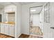 Hallway view of an open closet with shelves and rod for clothing at 2028 Old Latter Rd, Newton, NC 28658