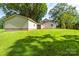 View of home and garage with the green and expansive yard between them at 2028 Old Latter Rd, Newton, NC 28658