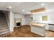 Open concept kitchen with stainless appliances, wood-look flooring, and a breakfast bar at 2028 Old Latter Rd, Newton, NC 28658