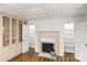 Inviting living room featuring a fireplace, built-in bookcases, and hardwood floors at 2028 Old Latter Rd, Newton, NC 28658