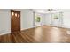 Bright living room featuring beautiful wood-look flooring, ceiling fan, and natural light streaming through the windows at 2028 Old Latter Rd, Newton, NC 28658