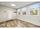 Room with wood-look floors, three windows, and a door at 2028 Old Latter Rd, Newton, NC 28658