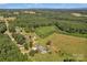Expansive aerial perspective capturing the farm's vast fields and wooded landscapes at 2145 Jack Wilson Rd, Shelby, NC 28150