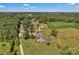 Expansive aerial view of a home with a pool surrounded by lush greenery at 2145 Jack Wilson Rd, Shelby, NC 28150