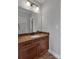 Bathroom vanity in earth tones featuring a granite countertop and undermount sink at 2145 Jack Wilson Rd, Shelby, NC 28150