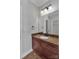 Bathroom featuring a wood vanity with granite countertop and a large mirror at 2145 Jack Wilson Rd, Shelby, NC 28150
