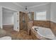 Bathroom view showcasing a glass shower, soaking tub, and neutral color scheme at 2145 Jack Wilson Rd, Shelby, NC 28150
