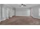 A spacious bedroom features neutral walls, carpet, ceiling fan, and ample natural light at 2145 Jack Wilson Rd, Shelby, NC 28150