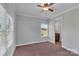 Cozy bedroom featuring natural light through the window and soft carpet flooring at 2145 Jack Wilson Rd, Shelby, NC 28150