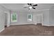 Neutral bedroom featuring plush carpet, large windows, and ample closet space at 2145 Jack Wilson Rd, Shelby, NC 28150