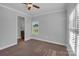 Comfortable bedroom with attached bath, carpet flooring, natural light, and a ceiling fan at 2145 Jack Wilson Rd, Shelby, NC 28150