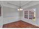 Cozy dining room with wainscoting, modern lighting, and large windows at 2145 Jack Wilson Rd, Shelby, NC 28150