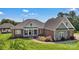 Beautiful brick home with a well-manicured lawn and inviting front porch, exuding curb appeal and charm at 2145 Jack Wilson Rd, Shelby, NC 28150
