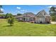 Charming brick home with a sprawling green lawn, showcasing its inviting facade under a bright sky at 2145 Jack Wilson Rd, Shelby, NC 28150