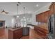 Bright and airy kitchen with hardwood floors, island with sink, and stainless appliances at 2145 Jack Wilson Rd, Shelby, NC 28150