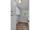 Functional laundry room with white cabinets, neutral paint, and tile flooring at 2145 Jack Wilson Rd, Shelby, NC 28150
