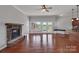 Inviting living room with hardwood floors, fireplace, and abundant natural light at 2145 Jack Wilson Rd, Shelby, NC 28150