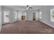 Spacious main bedroom with carpeted floors, a ceiling fan, and ample closet space at 2145 Jack Wilson Rd, Shelby, NC 28150