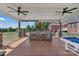 Spacious outdoor kitchen with a built-in grill, ample counter space, and a cozy entertainment area with a pool table at 2145 Jack Wilson Rd, Shelby, NC 28150