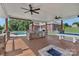 Outdoor kitchen with stainless appliances, overlooking the pool and fire pit, providing a luxurious entertainment space at 2145 Jack Wilson Rd, Shelby, NC 28150