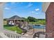 Inviting pool area with a slide, spa, and covered outdoor kitchen, perfect for entertaining and relaxation at 2145 Jack Wilson Rd, Shelby, NC 28150