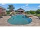 Gorgeous in-ground pool with a slide and spa, surrounded by a stone patio and well-manicured landscaping at 2145 Jack Wilson Rd, Shelby, NC 28150