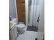 Modest bathroom with shower/tub, white tile, and storage cabinet at 2261 Felly Ln, Lancaster, SC 29720
