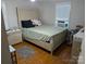 Bright bedroom features hardwood floors and neutral paint scheme at 2261 Felly Ln, Lancaster, SC 29720