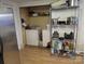 Convenient laundry area featuring a washer, dryer, and storage shelves, streamlining household chores at 2261 Felly Ln, Lancaster, SC 29720