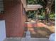 Side view of brick house with covered porch and swing at 2261 Felly Ln, Lancaster, SC 29720