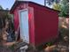 Exterior view of a red storage shed, offering practical storage solutions for outdoor equipment and tools at 2261 Felly Ln, Lancaster, SC 29720