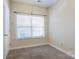 Neutral bedroom with carpet, window, and closet at 2785 Clover Nw Rd, Concord, NC 28027