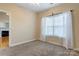 Inviting bedroom with soft carpet and natural light from the window at 2785 Clover Nw Rd, Concord, NC 28027