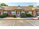 Brick condo with a well-manicured lawn in a convenient parking area at 2785 Clover Nw Rd, Concord, NC 28027