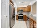 Well-lit kitchen featuring stainless steel appliances and tile flooring for a modern look at 2785 Clover Nw Rd, Concord, NC 28027