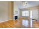 Inviting living room with hardwood floors and a cozy fireplace at 2785 Clover Nw Rd, Concord, NC 28027