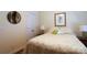 This bedroom features a cozy bed with a decorative patterned comforter and wood floors at 406 Spyglass Hill Pl, Salisbury, NC 28144